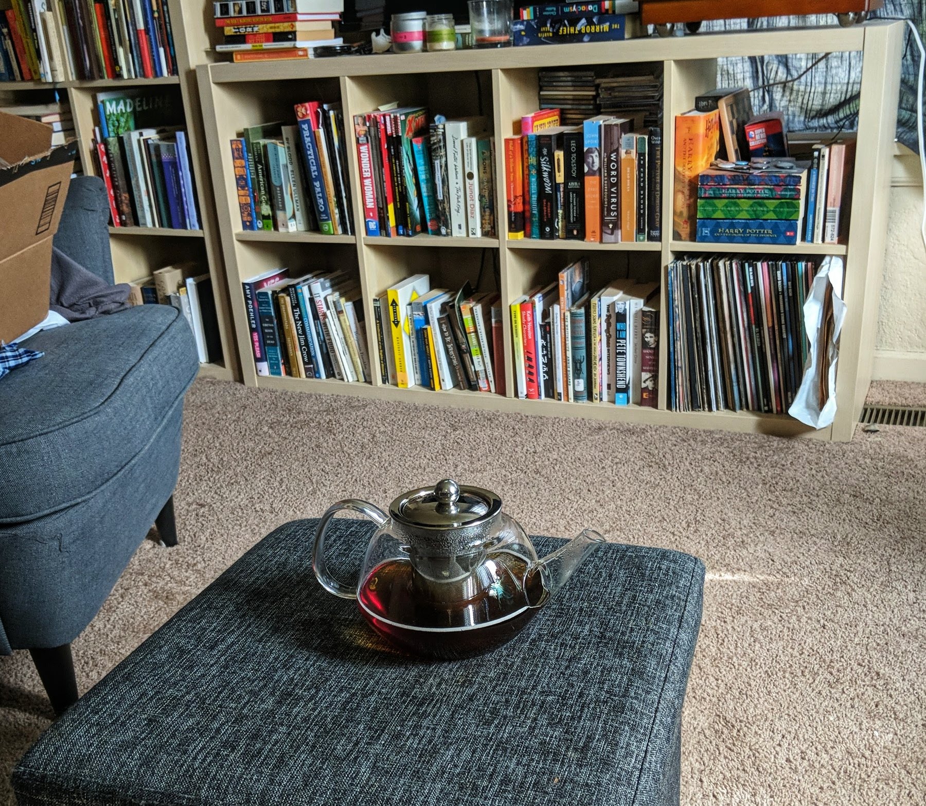 Pot of tea in front of bookshelf